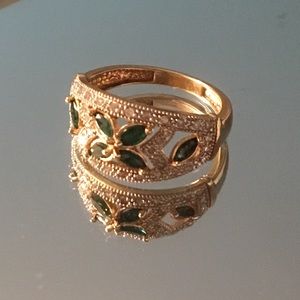 14kt gold, emerald, and diamond ring.